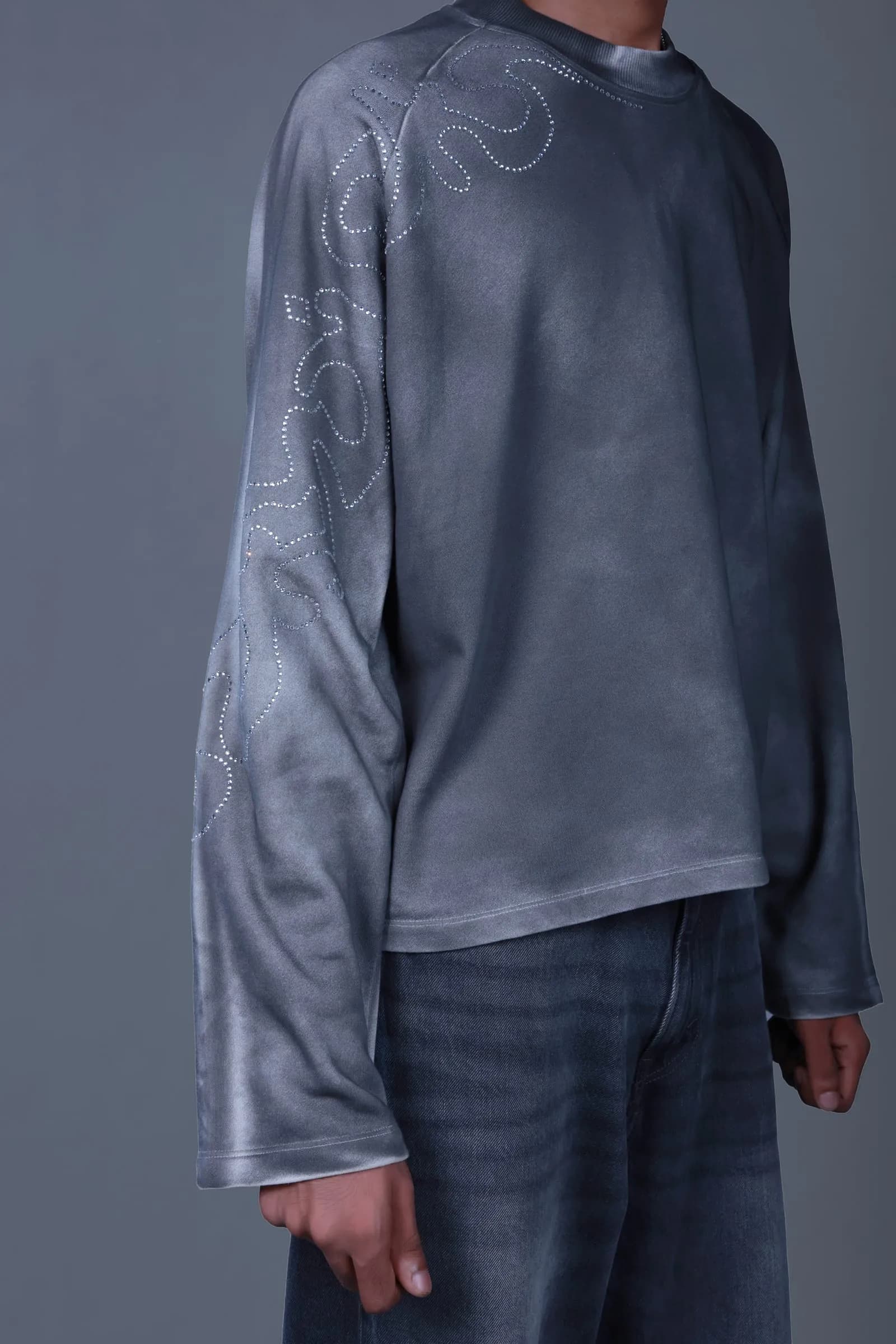 Detail of the spray-painted finish and rhinestone sleeve