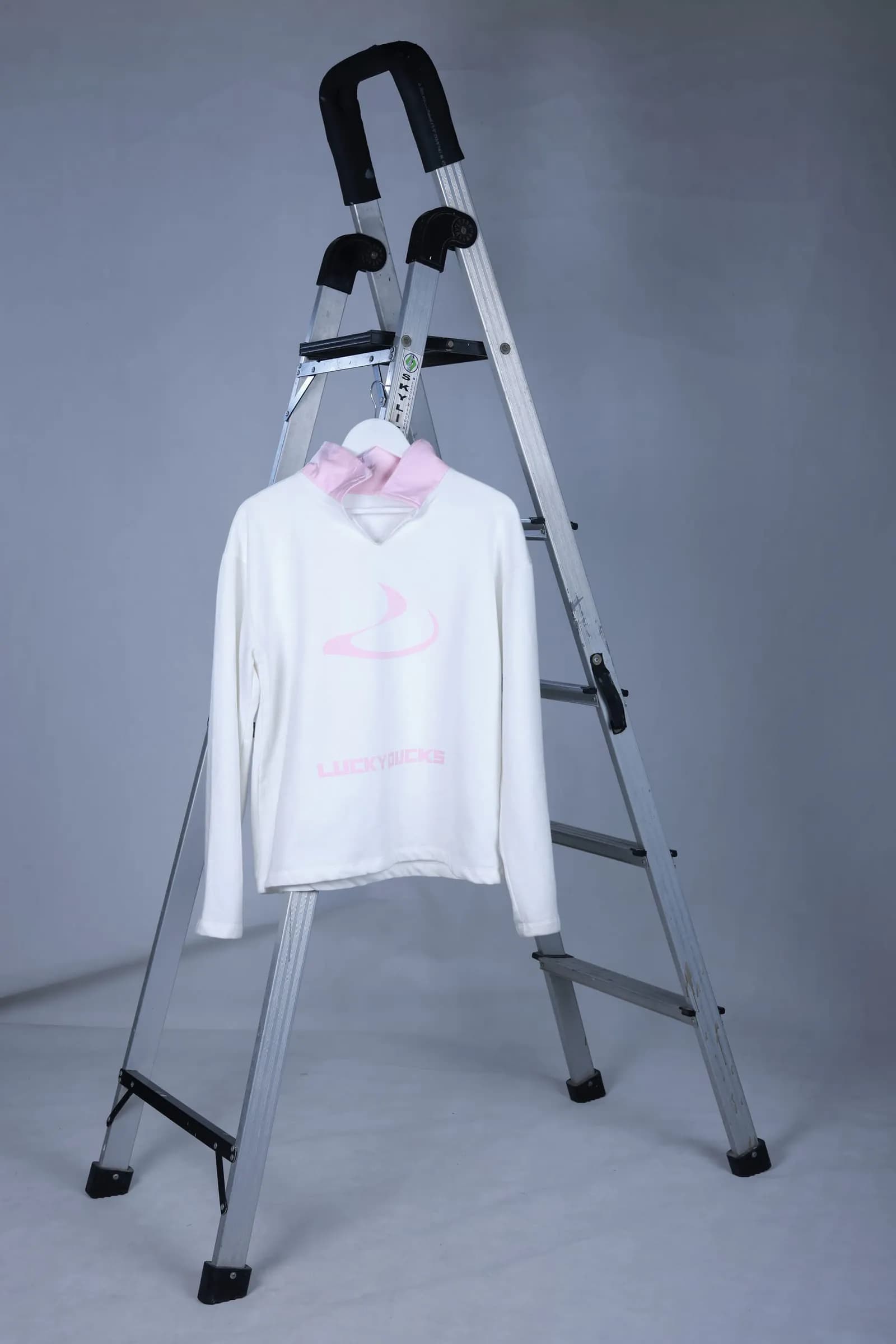 Signature Long-Sleeve on a hanger showing the centre branding