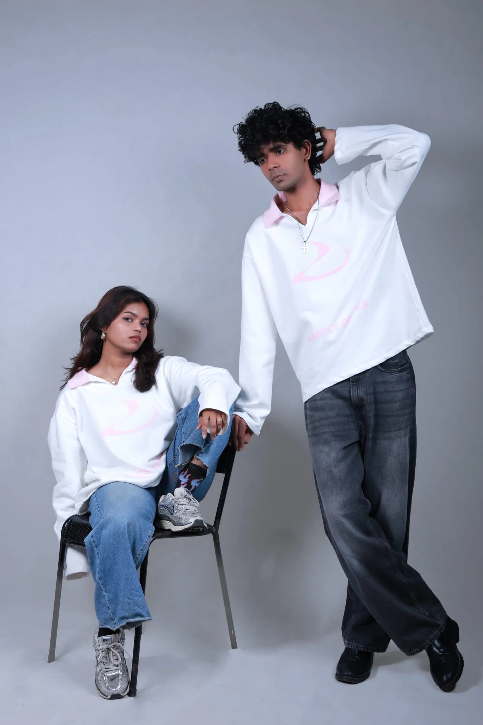 Two models in the Signature Long-Sleeve, one seated, one standing