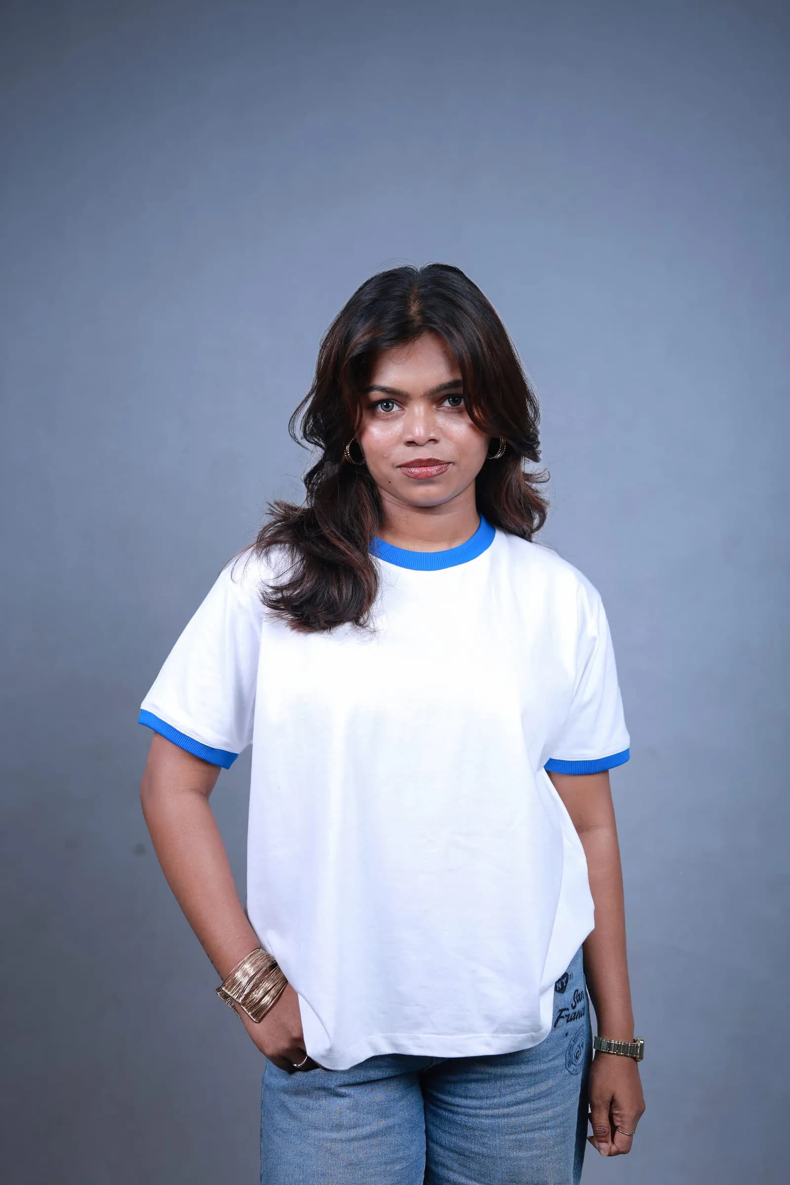 Vintage Ringer Baby Tee in white with blue ribbed trims, worn by a model
